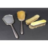 An Art Deco silver and yellow enamel backed dressing table set, decorated with wavy lined