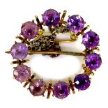 A gold and amethyst wreath brooch, the amethysts of graduated colour or ombre design, 2.1cm