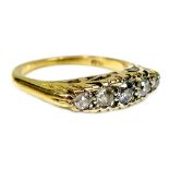 An 18ct gold five stone diamond ring, the stones of graduated size, largest of approximately 2mm