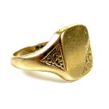A 9ct gold gentleman's signet ring, the blank cartouche with foliate engraved corner and