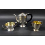 An Art Deco Anglo-Indian silver three piece bachelors tea service, circa 1925, of tapering