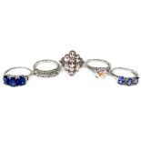 A group of gold and silver rings by the Genuine Gemstone Company, comprising two 9ct white gold