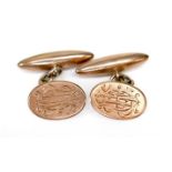 A pair of Edward VII 9ct gold cufflinks, of oval form with engraved monogram, chain links to torpedo