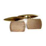 A pair of 9ct gold cufflinks, or rounded rectangular form with engine turned decoration, marked H.
