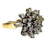 A 9ct gold and diamond cluster ring, set with 25 brilliant cut stones in a chrysanthemum design,