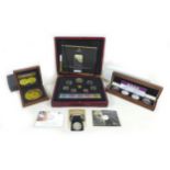 A collection of ERII silver proof and other coin sets, including a limited edition London Mint