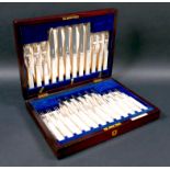 A George V silver set of silver and mother of pearl handled dessert flatware, forks 15.5cm long,