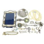 A small group of jewellery and silver items, including a silver photograph frame, 14 by 10cm, an 830