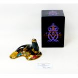 A limited edition Royal Crown Derby paperweight, modelled as a sea lion, numbered 26/250 and with