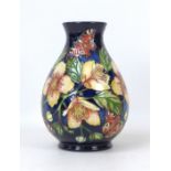 A Moorcroft pottery Amber Glow pattern limited edition vase, in baluster form, signed Seb Leeper and