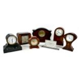 A group of seven Victorian and Edwardian mantel clocks, including an Art Nouveau clock with inlaid