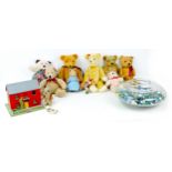 A group of retro and vintage toys, including a collection of marbles, soft toys, and vintage scratch