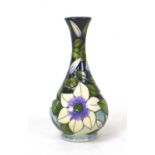 A Moorcroft pottery Sophie Christina pattern bottle vase, by Sian Leeper, with impressed marks to