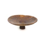 An early 20th century Moroccan wooden Ksaa bowl, for preparing cous cous, of circular form with
