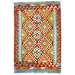A Chobi Kelim rug, with three central blue and white diamonds to the multicolour ground, and