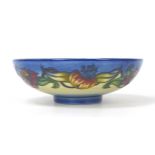 A Moorcroft pottery Tiger Lily pattern bowl, with impressed marks to base, 25.5 by 8.5cm high,