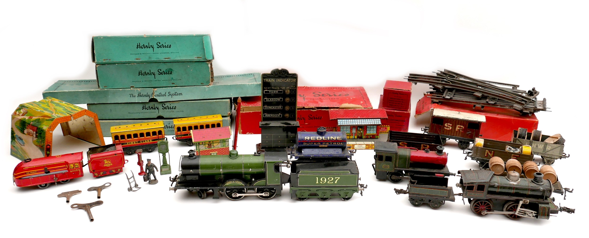 A collection of O gauge tinplate railway, early 20th century, including a clockwork Bassett-Lowke