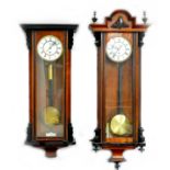 Two 20th century Vienna wall clocks in need of restoration, each with enamel dial, single weight and