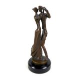 Bernard Kim (b. 1942): A bronze sculpture of a couple dancing, raised on a pedestal base, signed '