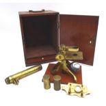 A 20th century J. H. Steward brass microscope, in original mahogany case, with accessories.