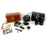 A small group of cameras and equipment, comprising a Bolex Paillard B8L 8mm cine camera, a