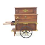 A miniature Victorian style street musical organ grinder, with brass fittings, and extra musical