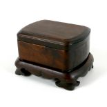 A Chinese carved wooden seal box, on stand, late 20th century, 14 by 11.5 by 9cm high.