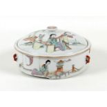 A Chinese porcelain box and cover, probably 19th century, of squat cylindrical form, with four small