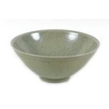 A Chinese porcelain bowl, late 20th century, incised decoration beneath a green glaze, 18.5 by 8cm