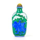 A Chinese glass scent bottle, flashed blue and white, decorated with bats and pomegranates, green