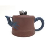 A Chinese Yixing pottery teapot, with panda form finial, contracting colour bamboo effect handle and