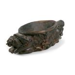 An unusual Asian 19th century teak offertory or libation bowl, carved with a twin headed fish with