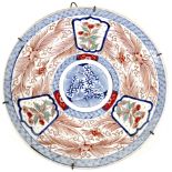 A Japanese porcelain charger dish, Edo period, early to mid 19th century, decorated in underglazed