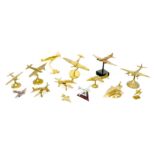 A collection of 20th century and later brass aircraft models, including a Spitfire, 15.5cm high a