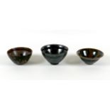 A group of three Chinese pottery bowls, late 20th century, with black and brown glazes, the