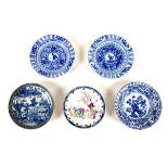 A group of 18th and 19th century Chinese porcelain saucer dishes, one decorated in Willow pattern