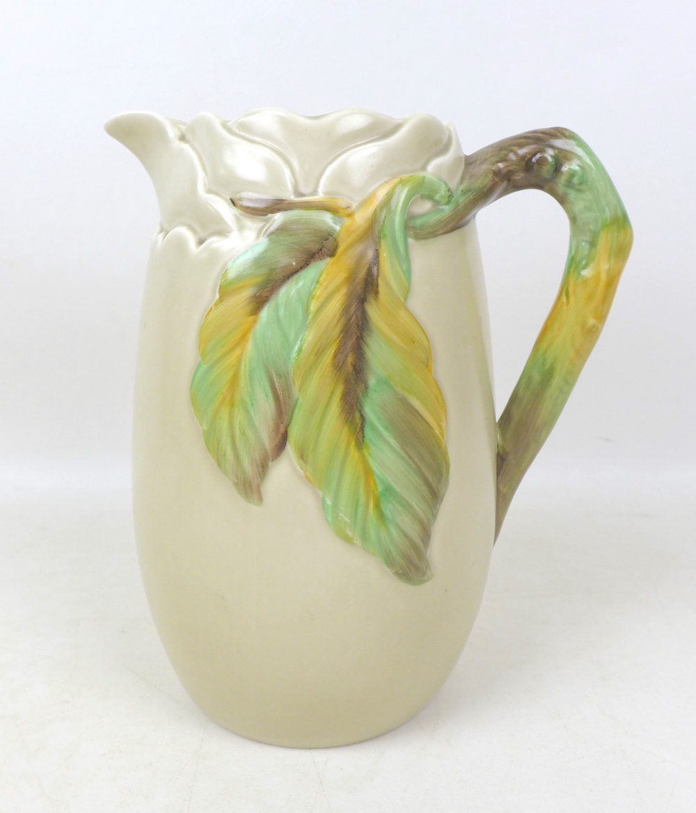 A group of four water jugs, including a Clarice Cliff tall jug with leaf and branch stylised handle, - Image 2 of 13