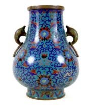 A Chinese cloisonné enamel twin handled vase, Qing Dynasty, mid to late 19th century, of Hu form,