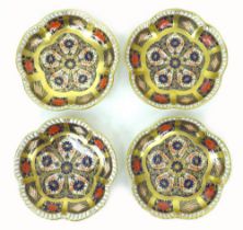 A set of four Royal Crown Derby Imari dishes, 1128, with scalloped edges and richly gilded, 11 by