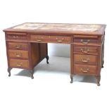 A Globe Wernicke mahogany twin pedestal desk, with an arrangement of nine drawers, brass swan neck