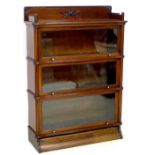 A Globe Wernicke bookcase, in three sections, each section with hinged glazed front, maker's stamp