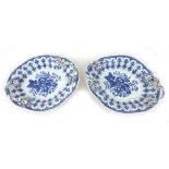 A pair of 18th century Worcester porcelain oval twin handled trays, moulded with blue and white