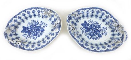 A pair of 18th century Worcester porcelain oval twin handled trays, moulded with blue and white