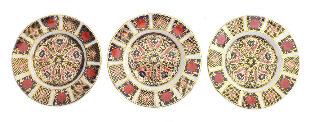 Three Royal Crown Derby plates, in the Imari pattern, 1128, 16cm diameter. (3)