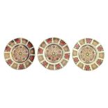 Three Royal Crown Derby plates, in the Imari pattern, 1128, 16cm diameter. (3)