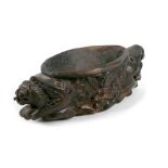 An unusual Asian 19th century teak offertory or libation bowl, carved with a twin headed fish with