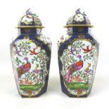 A pair of 18th century Worcester lidded vases, hand painted with exotic birds to two of the six