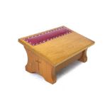 A Lyndon Hammell Cat and Mouseman oak kneeler, the sloping top with inset padded red leather