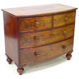 A Victorian mahogany bow fronted chest of two over two drawers, raised upon turned feet, 106.5 by 58