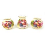 Three pieces of Royal Worcester by Kitty Blake, comprising a pair of globular vases, 7cm high,